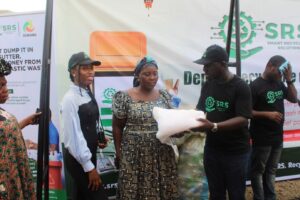Figure 3: Picture of Beneficiary who received a net to package her recyclables together for pickup